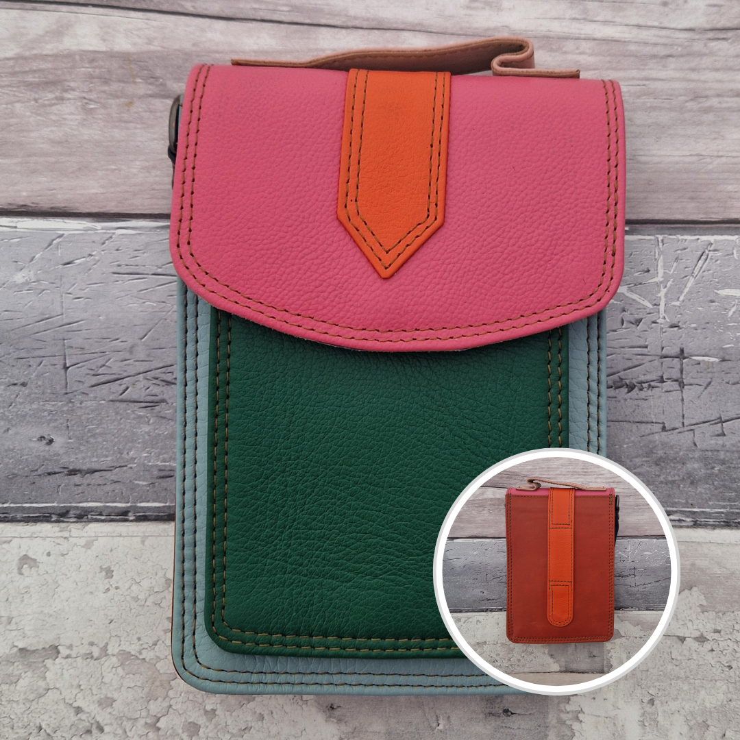 All leather crossbody bag with carry handle made up in a variety of brightly coloured panels.