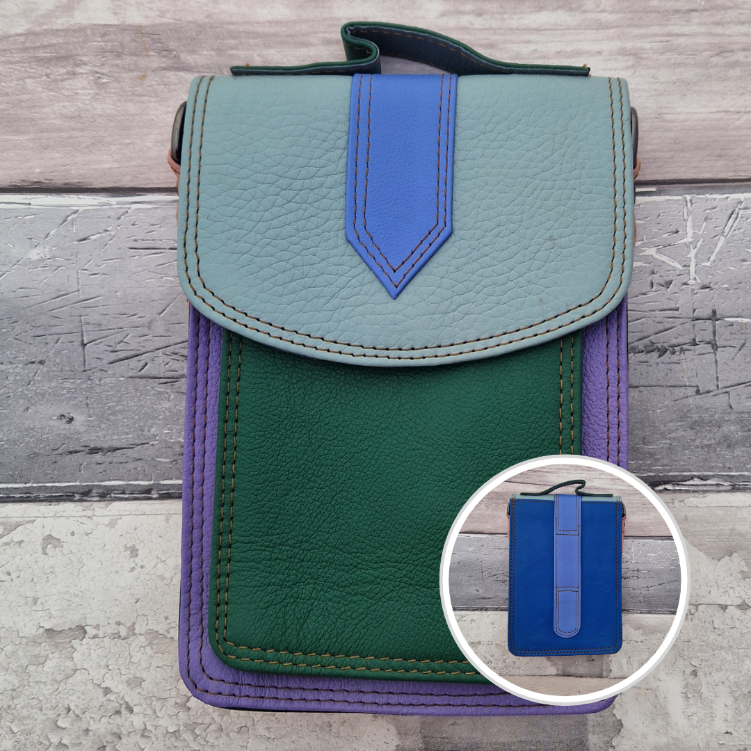 All leather crossbody bag with carry handle made up in a variety of brightly coloured panels.