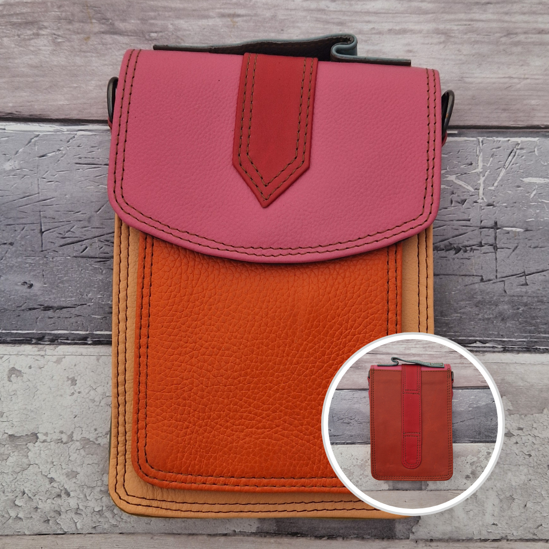 All leather crossbody bag with carry handle made up in a variety of brightly coloured panels.