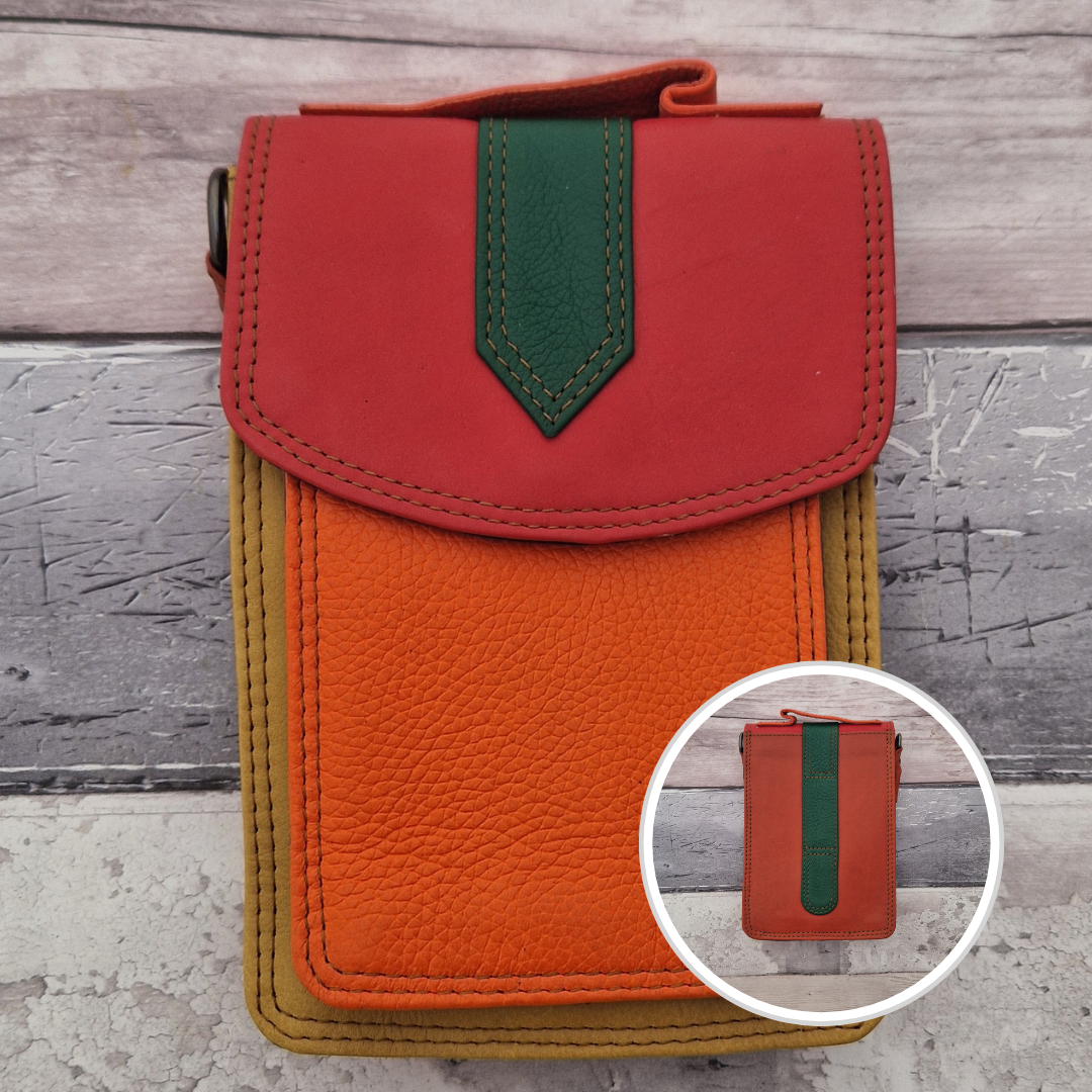 All leather crossbody bag with carry handle made up in a variety of brightly coloured panels.