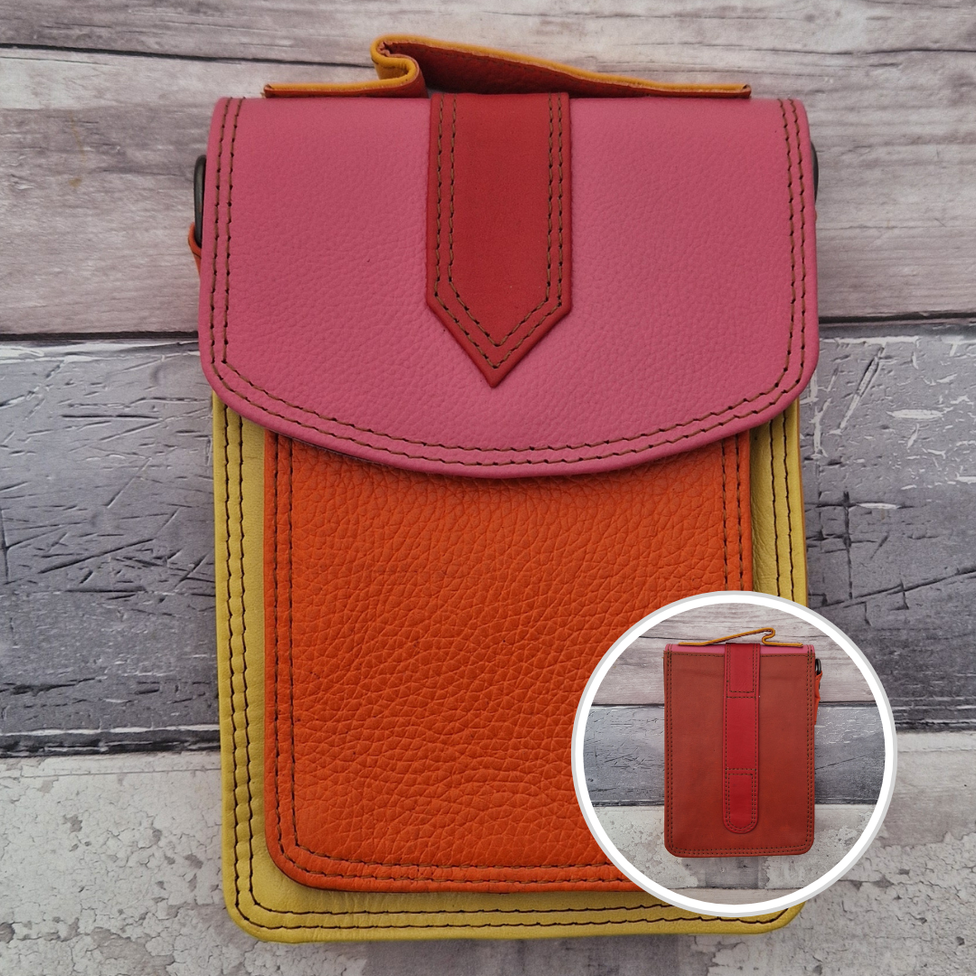 All leather crossbody bag with carry handle made up in a variety of brightly coloured panels.