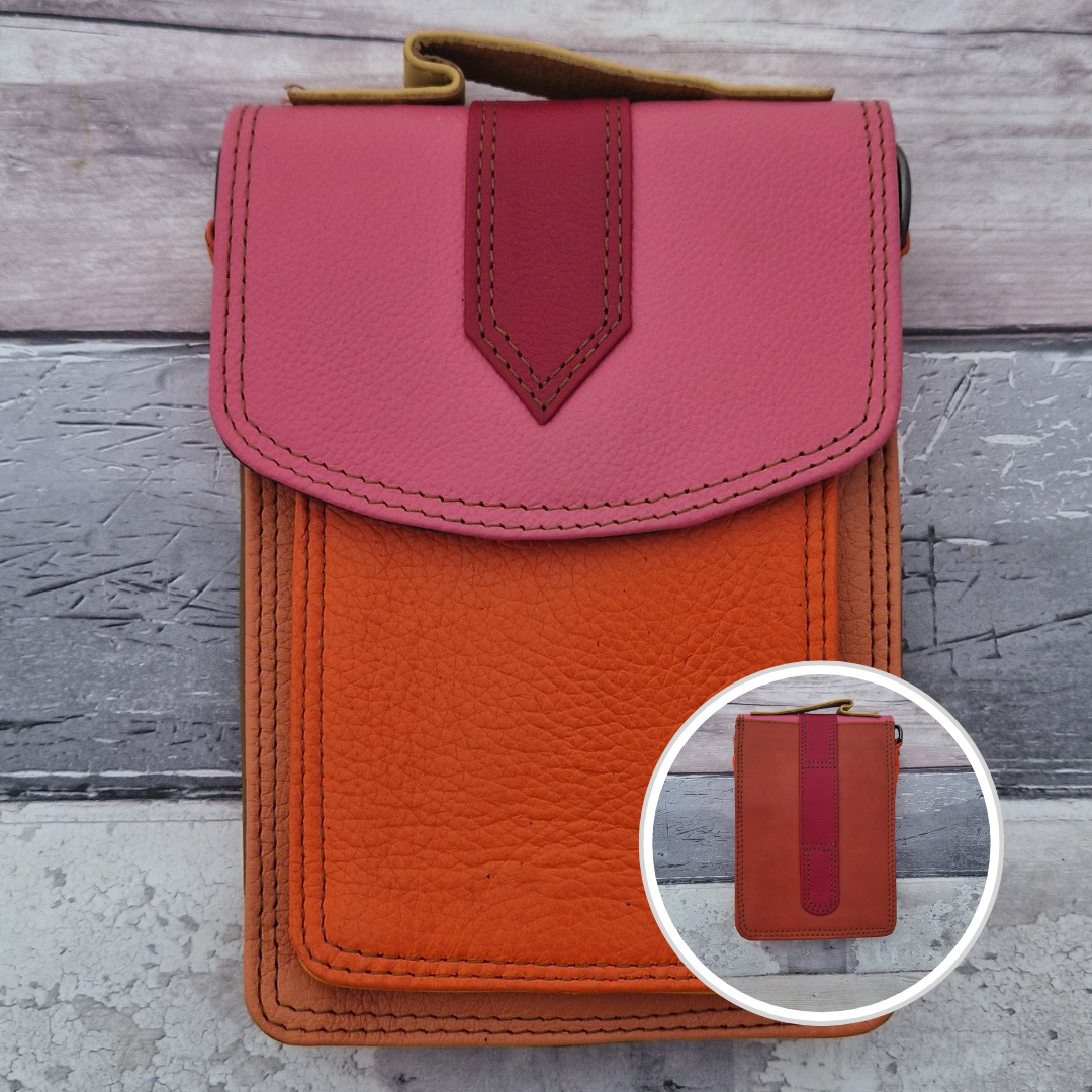 All leather crossbody bag with carry handle made up in a variety of brightly coloured panels.