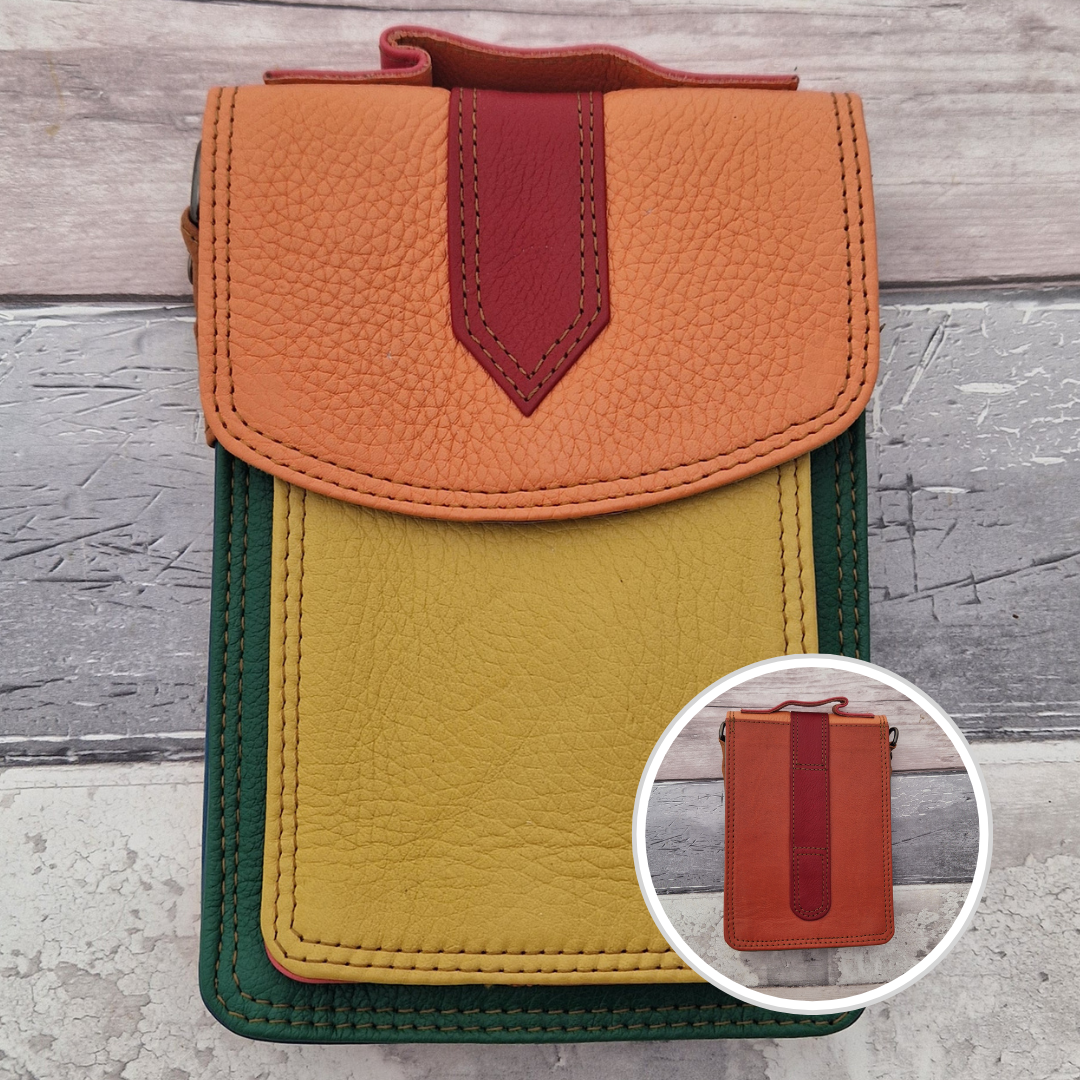 All leather crossbody bag with carry handle made up in a variety of brightly coloured panels.