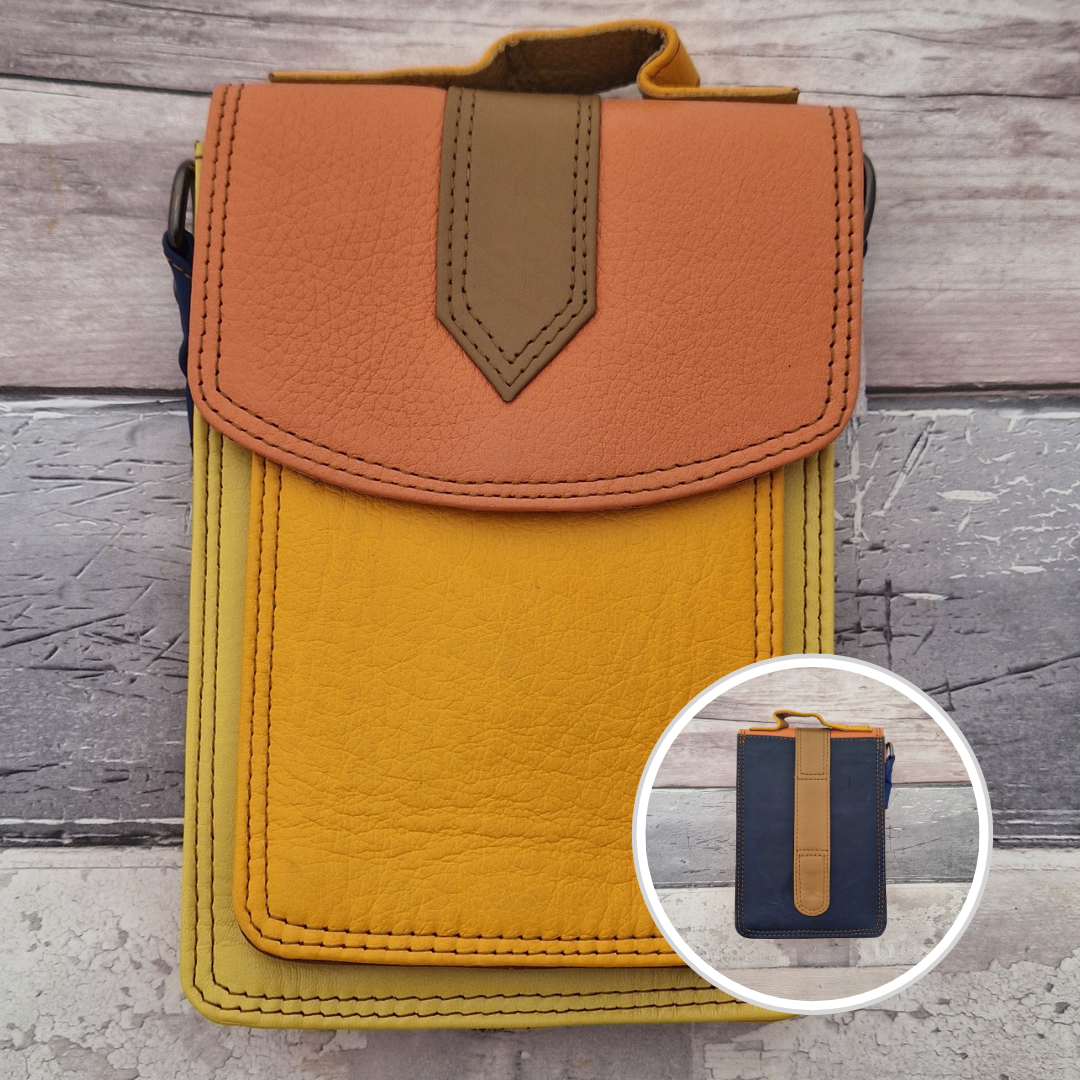 All leather crossbody bag with carry handle made up in a variety of brightly coloured panels.