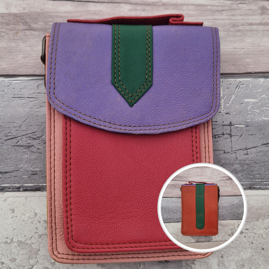 All leather crossbody bag with carry handle made up in a variety of brightly coloured panels.