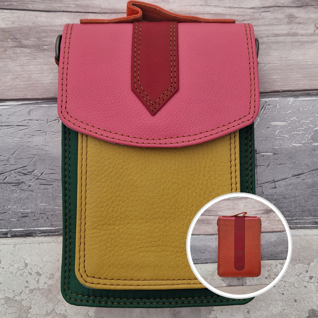 All leather crossbody bag with carry handle made up in a variety of brightly coloured panels.