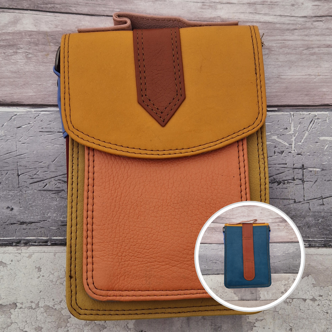 All leather crossbody bag with carry handle made up in a variety of brightly coloured panels.