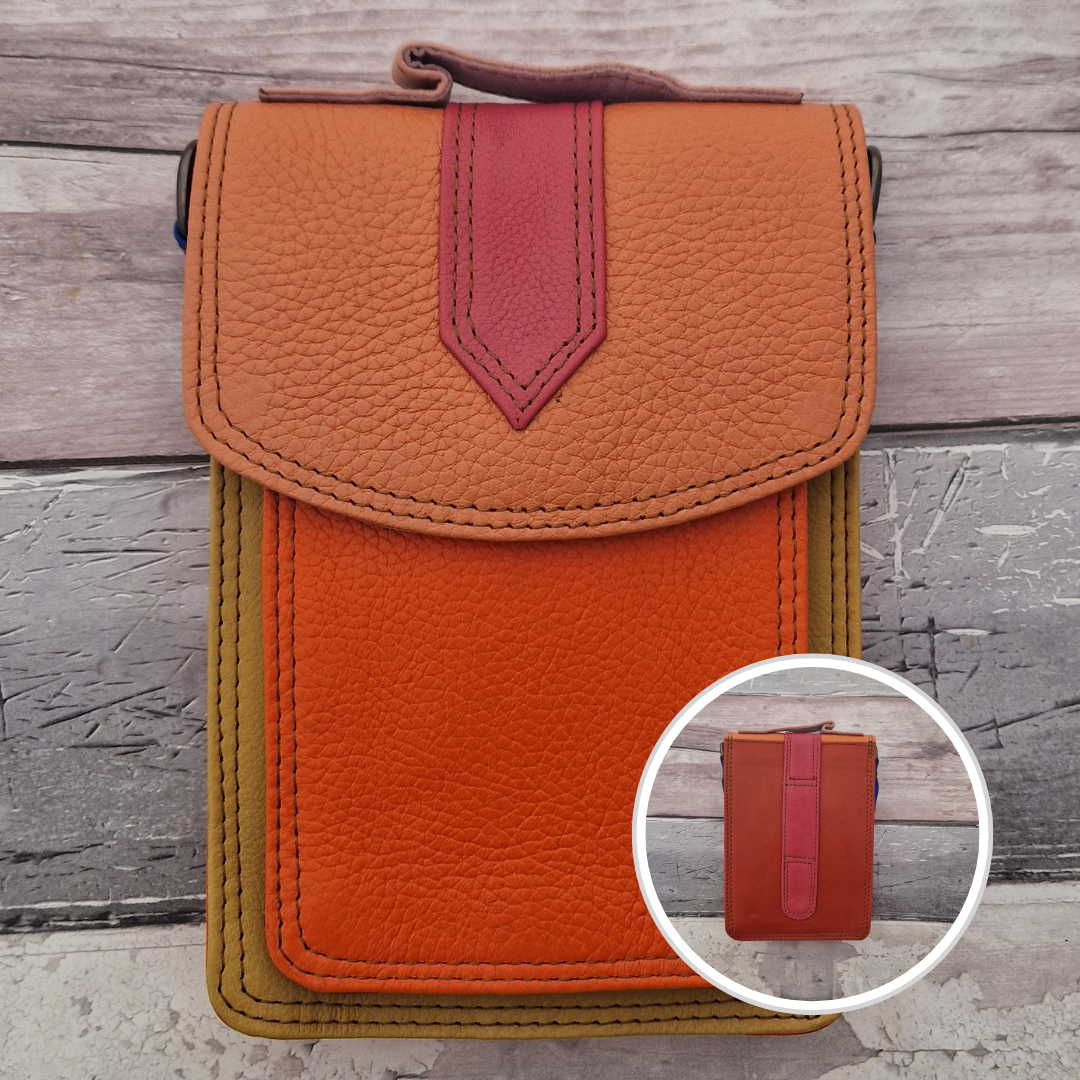 All leather crossbody bag with carry handle made up in a variety of brightly coloured panels.