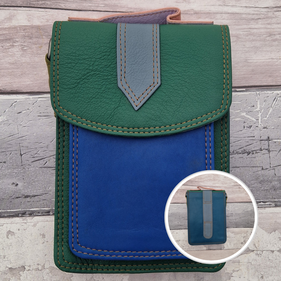 All leather crossbody bag with carry handle made up in a variety of brightly coloured panels.