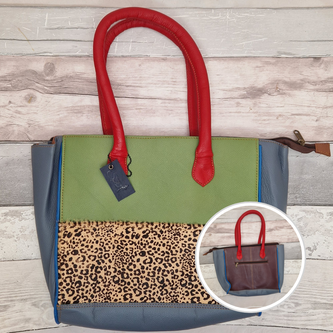 Long handled ladies handbag made from brightly coloured leather off-cuts with a textured panel of Cheetah print.