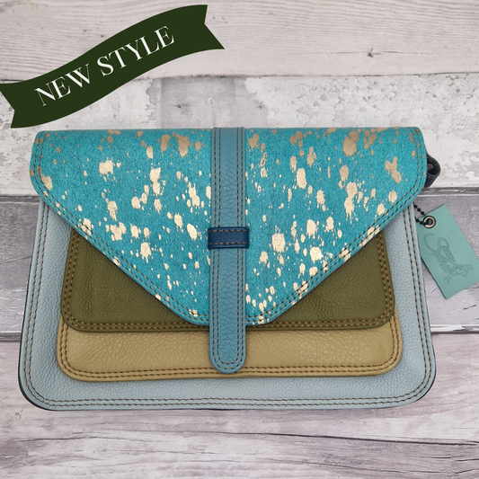 Rectangular shaped envelope crossbody bag made from leather off-cuts. Blue, green and pale mustard coloured panels are finished with a striking turquoise textured panel.