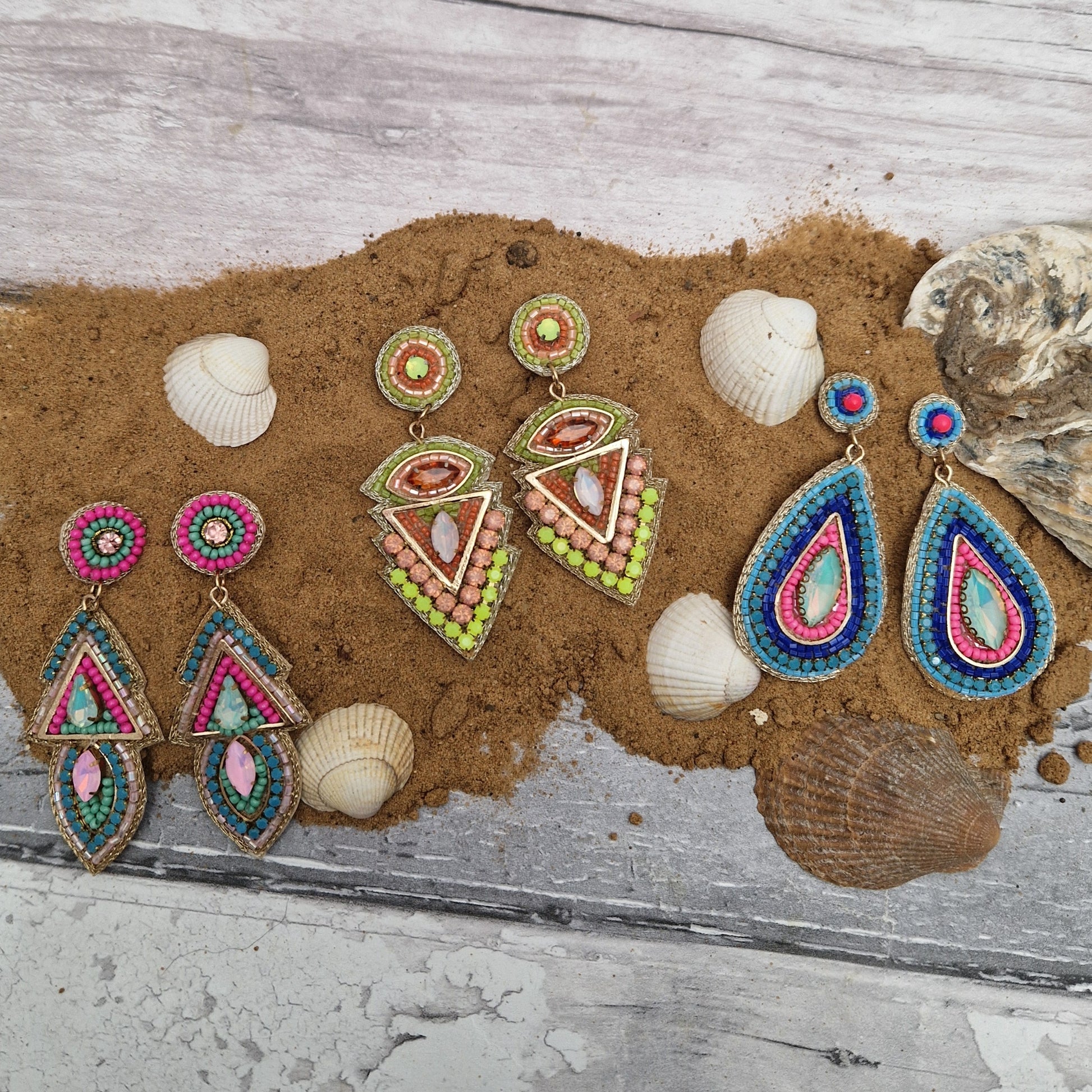 Aztec inspired earrings in bold pink, blue, lime and gold colours, 3 separate pairs.
