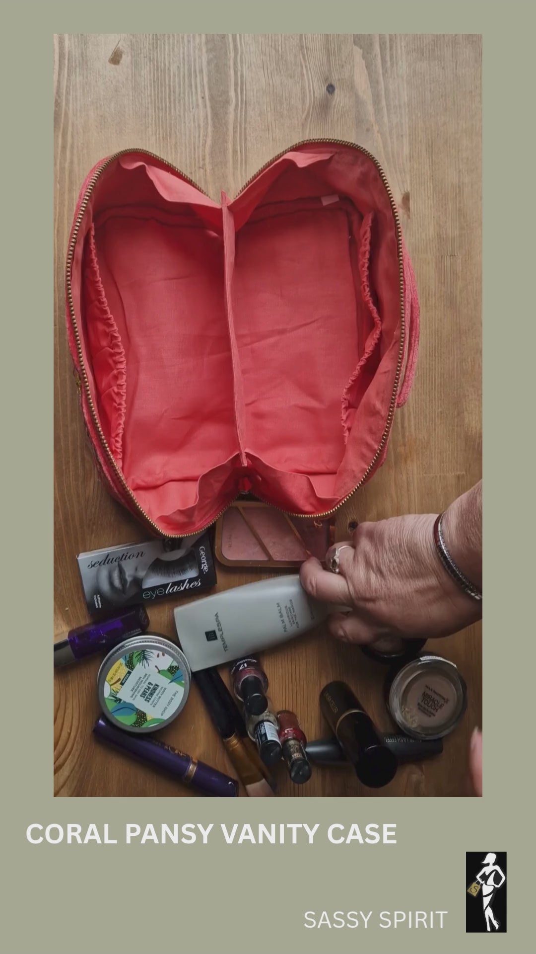 Fold out vanity case being filled with make up, demonstrating how it closes up.