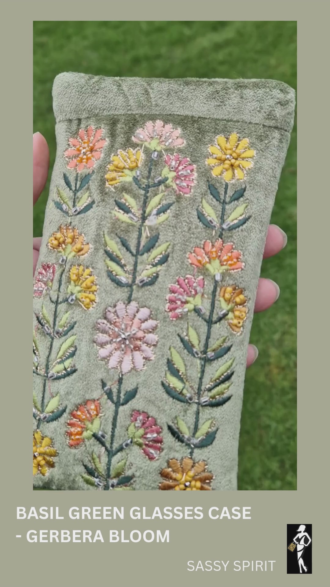 Video of green velvet gerbera bloom glasses case.