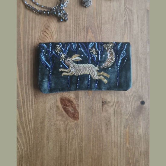Video showing a Velvet Jewellery Roll decorated with a hand embroidered image of hare running through woods on a moonlit night.