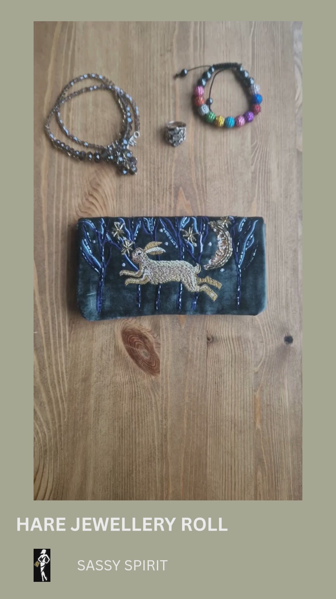 Video showing a Velvet Jewellery Roll decorated with a hand embroidered image of hare running through woods on a moonlit night.