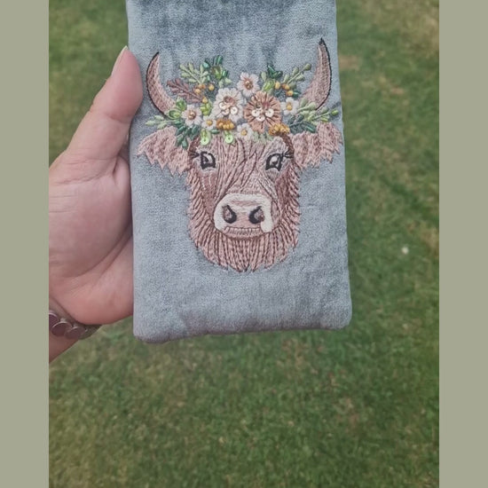 Grey velvet glasses case decorated with an embroidered Highland Cow. Finished with beads and sequins.