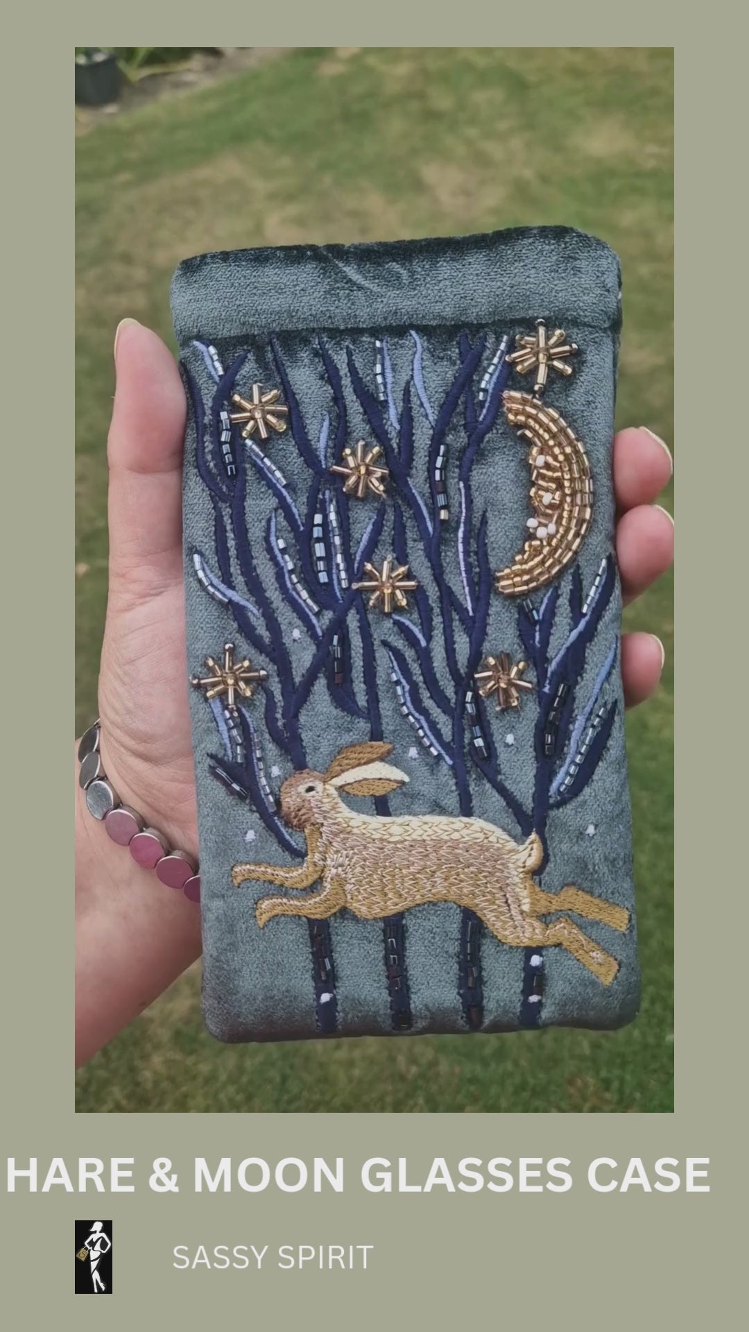 Dark grey velvet glasses case decorated with an embroidered Hare running through the woods under a crescent moon and starry night scene. Finished with beads and sequins.
