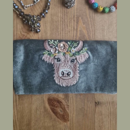 Velvet Jewellery Roll decorated with a hand embroidered image of a Highland Cow.