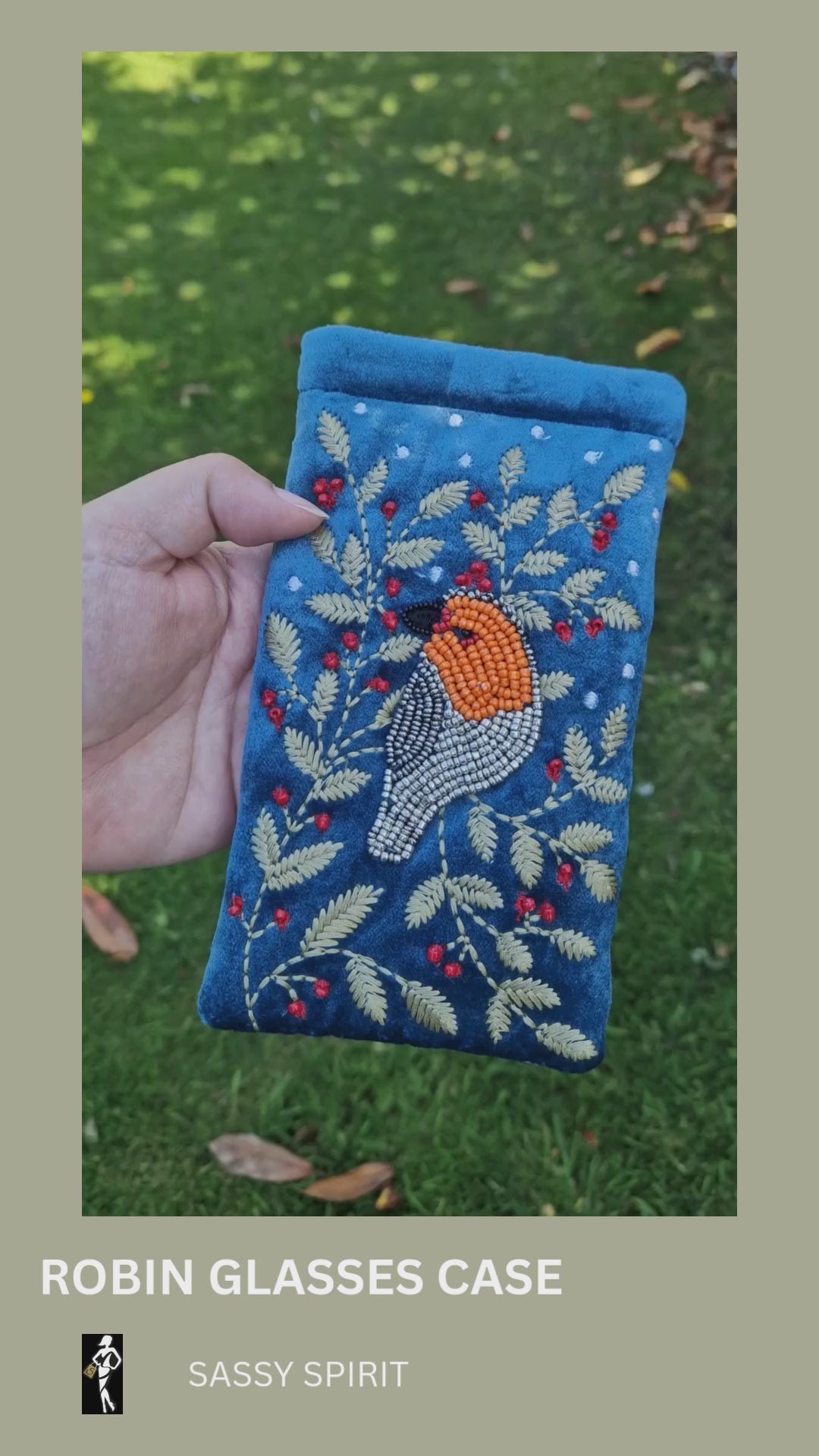Dusky Blue Velvet Glasses Pouch decorated with an embroidery and bead design featuring a Robin surrounded by festive holly.