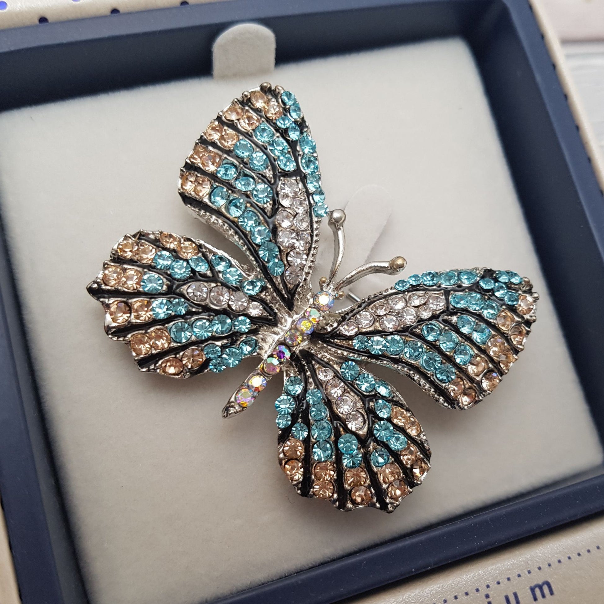 Close up photo of a Blue Butterfly Brooch