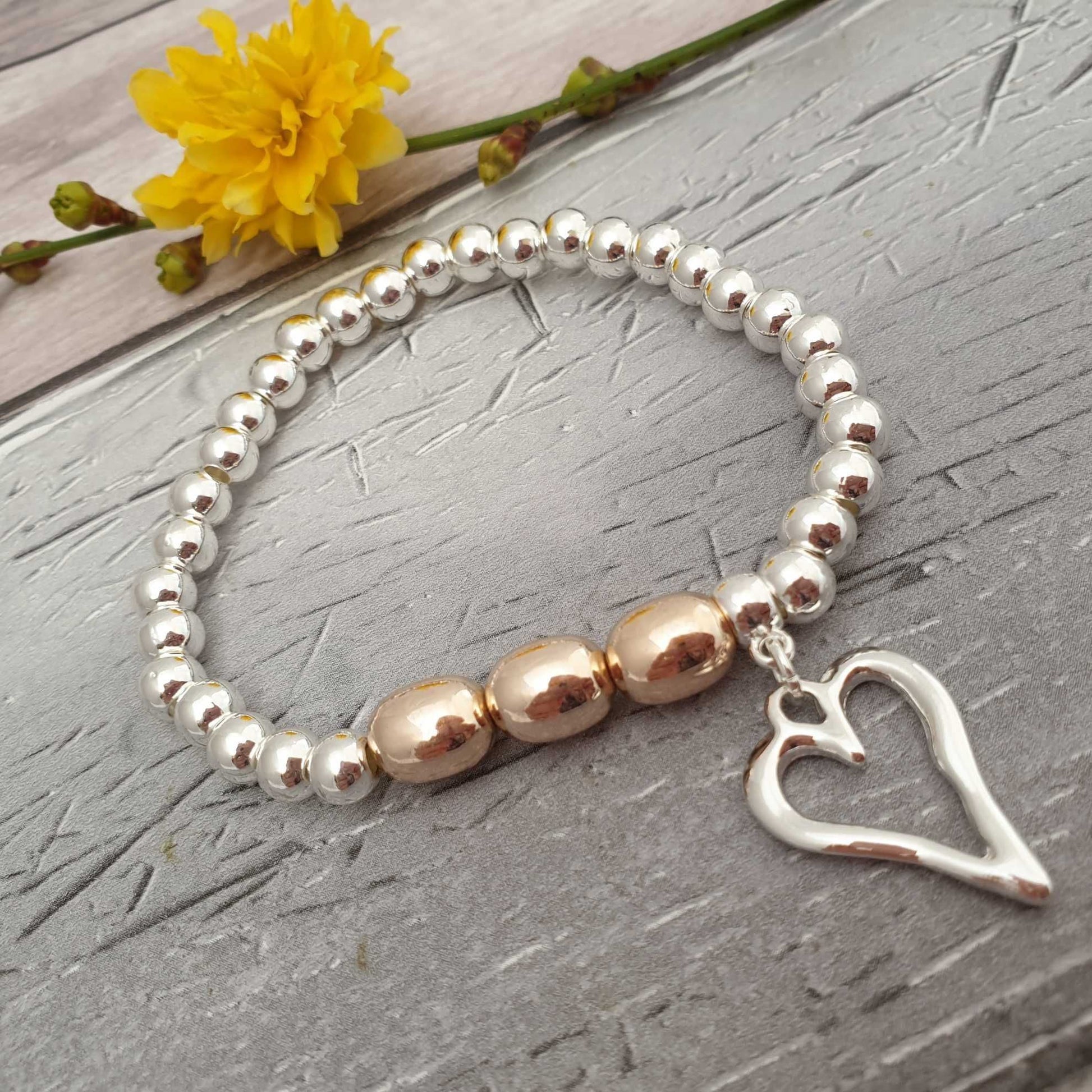 Photo of a silver bracelet with love heart charm