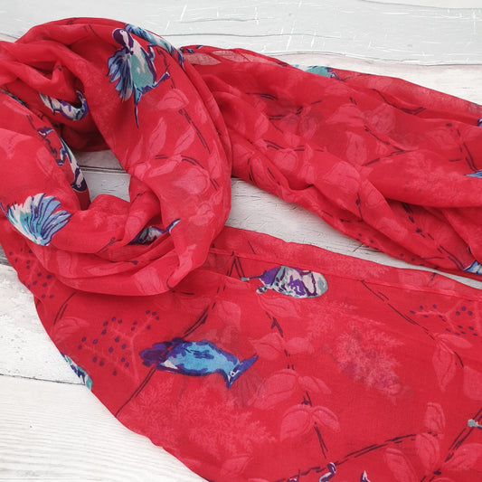 Photo of a red scarf covered in Blue Tit Birds