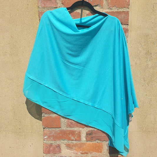 Photo of a Turquoise Blue Poncho with chiffon trim