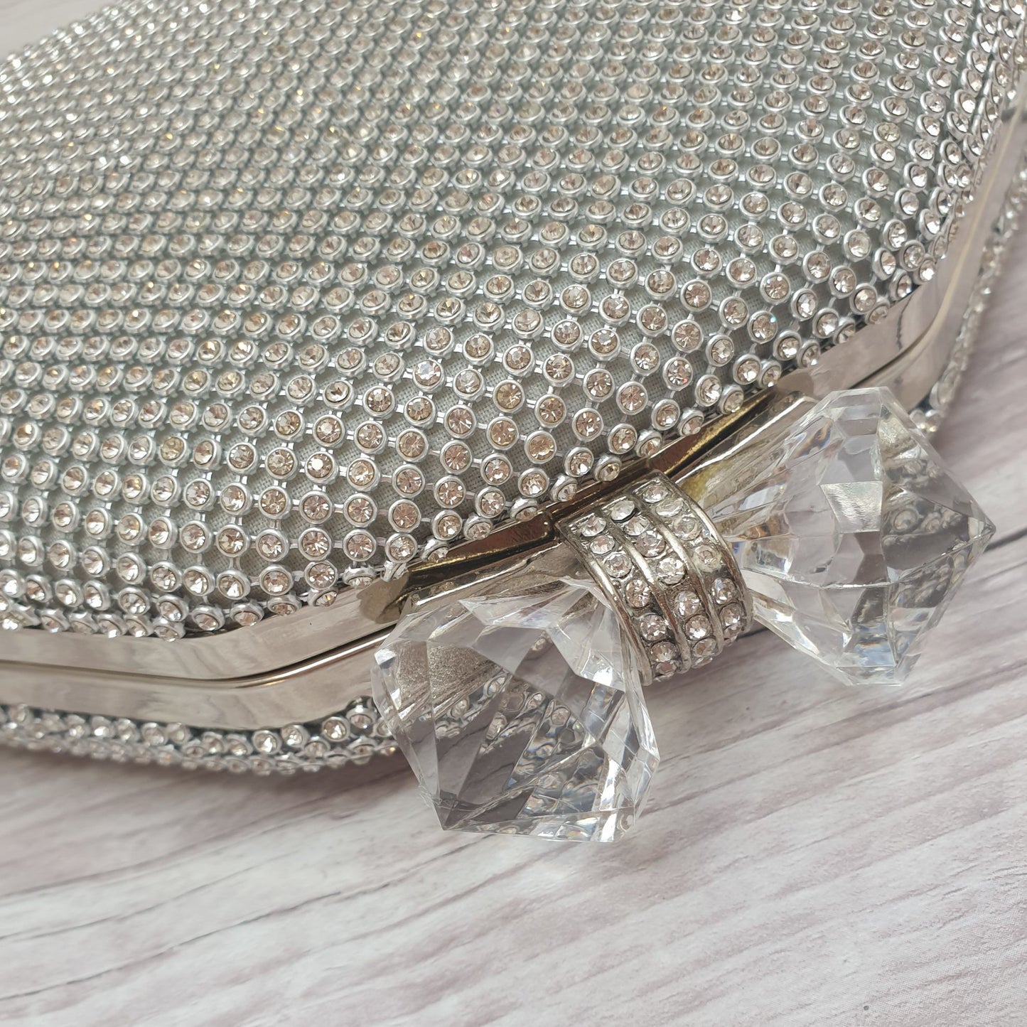 Photo of a Silver diamante clucth bag with large double crystal clasp