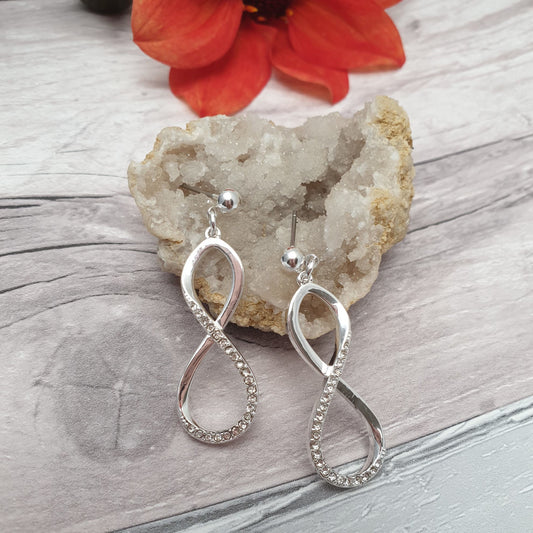 Photo of a pair of dangly infinity loop earrings