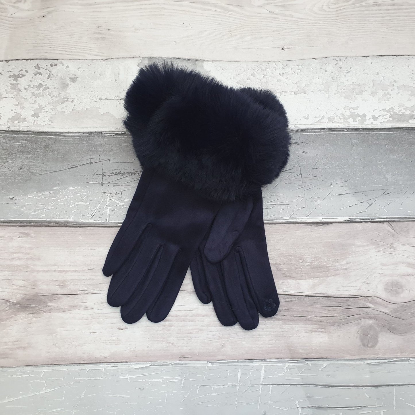Photo of a pair of navy gloves with a faux fur trim