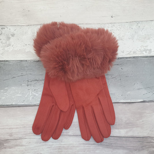 Photo of a pair of rust coloured gloves with faux fur cuffs