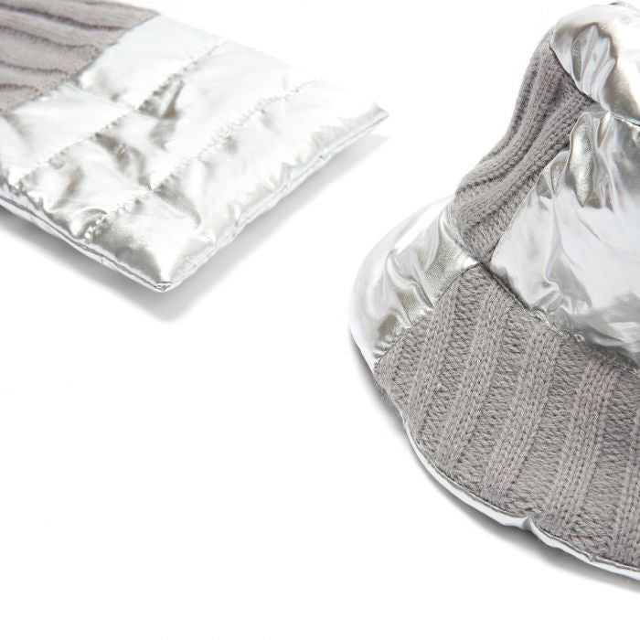 Photo of a metallic silver hat and scarf set. Puffa and traditional knit combined style