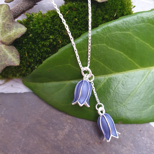 Photo of a silver chained bluebell pendant with 2 hand painted bluebells