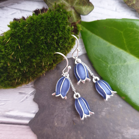 Photo of a pair of dangly bluebell earrings with a double flower