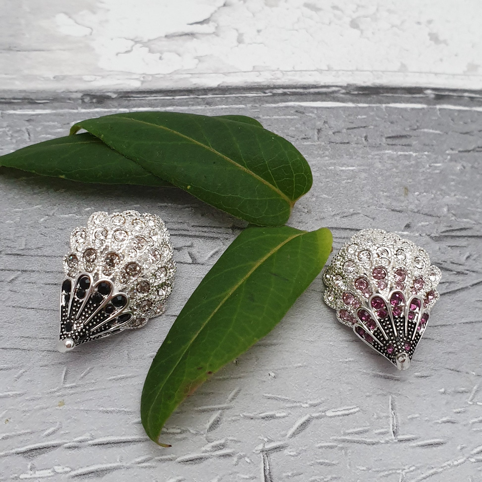 2 diamante crystal hedgehog brooches, 1 in pink and the other black