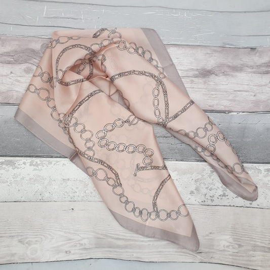Pale pink designer inspired scarf with large link chain pattern.