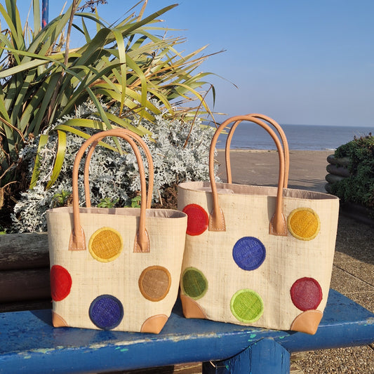 Natural Raffia Baskets with coloured spot pattern.