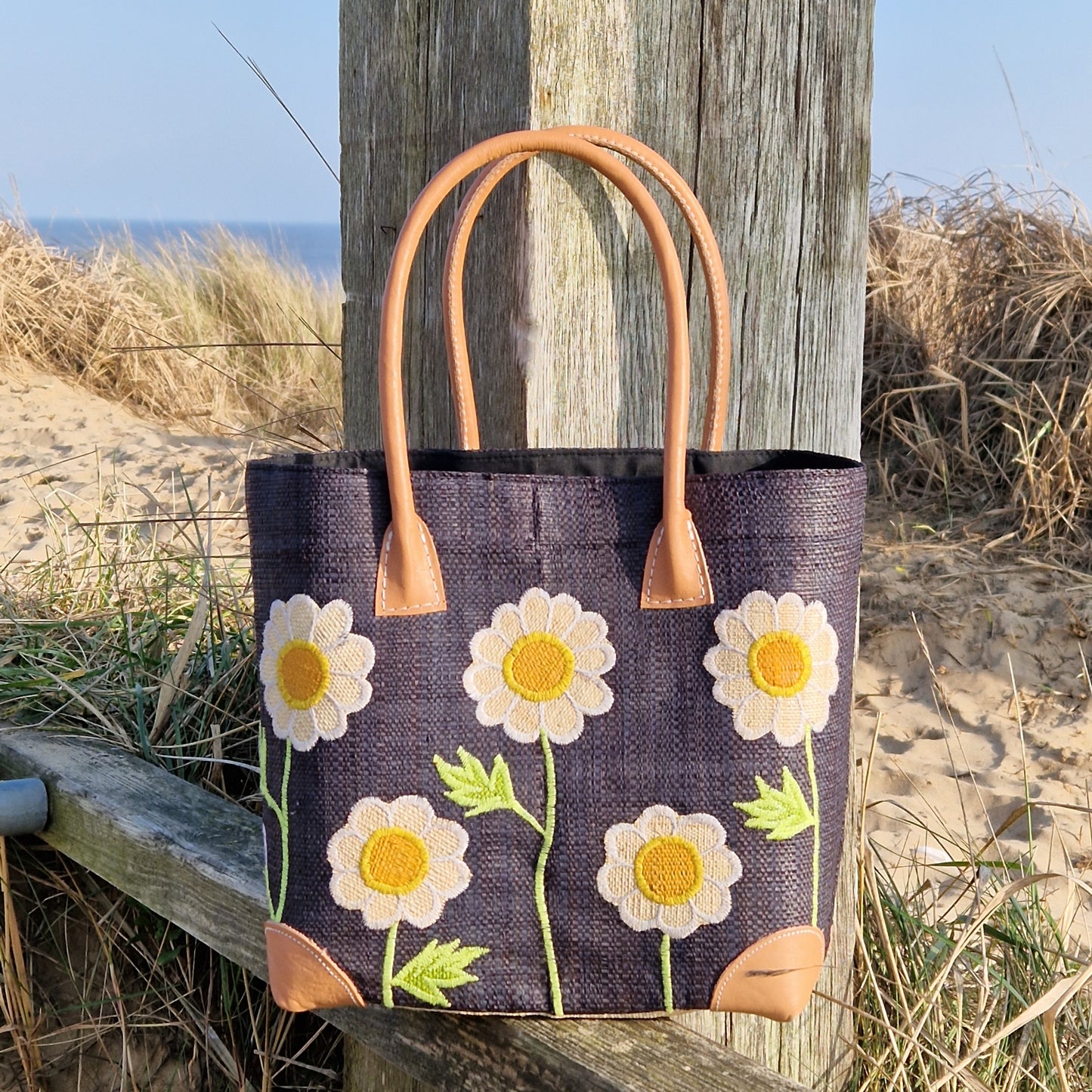 Black Raffia Basket decorated with white daisies.