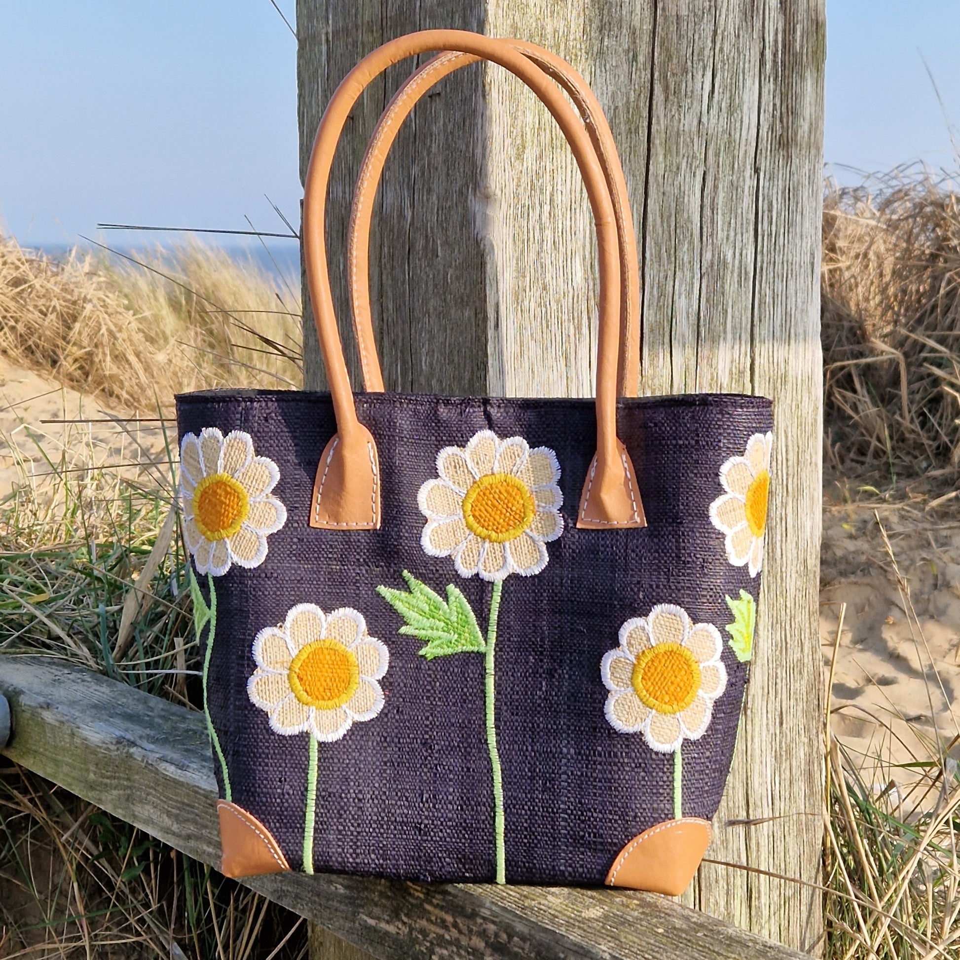 Black Raffia Basket decorated with white daisies.