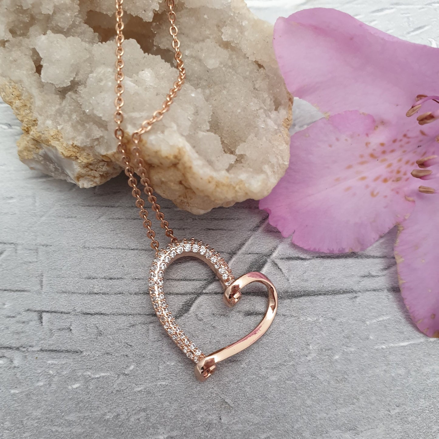 Rose Gold Plated necklace with a looped heart shaped pendant decorated with diamante crystals