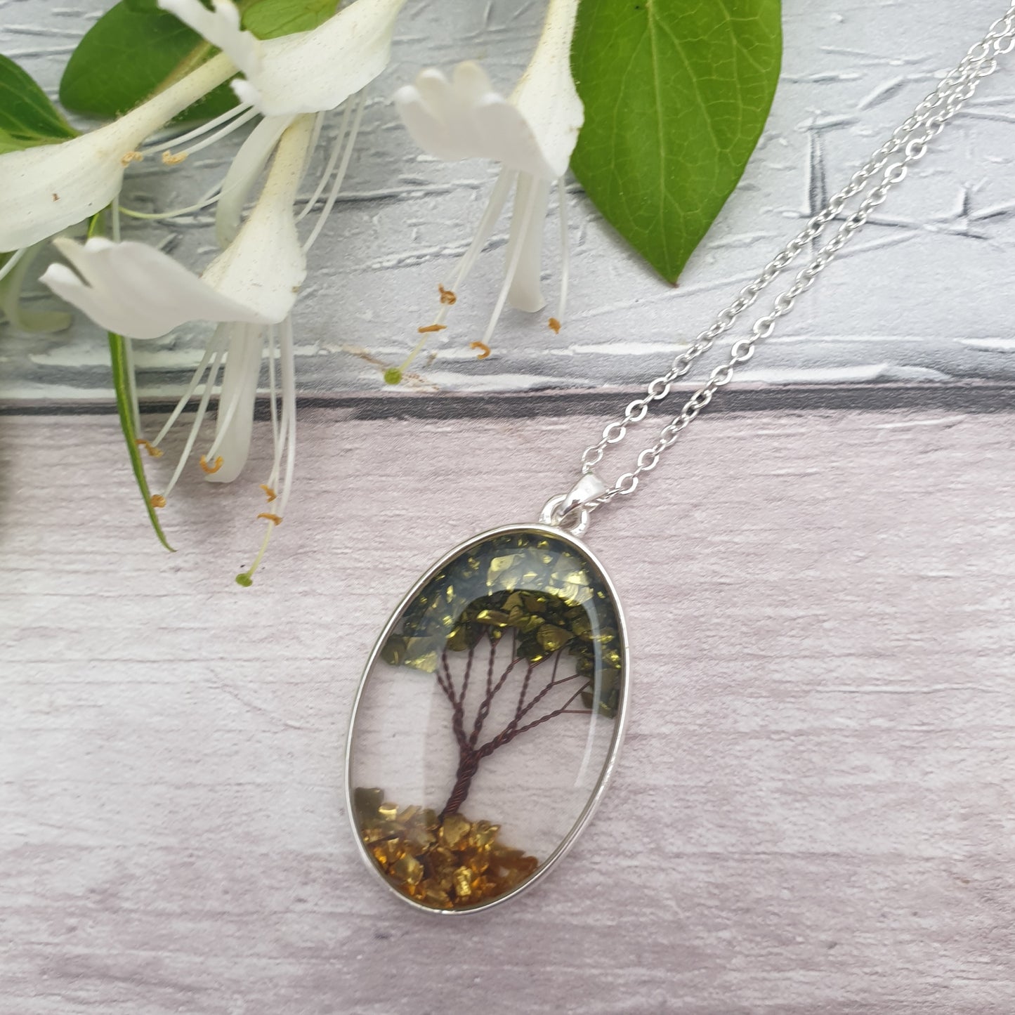 Tree of Life made from Semi-Precious Stones encased in an glass oval pendant