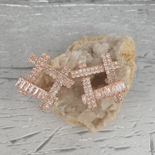 Large rode gold earrings in a square shape decorated with diamante crystals.