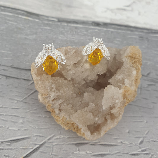 Yellow crystal bee earrings with dainty silver wings.