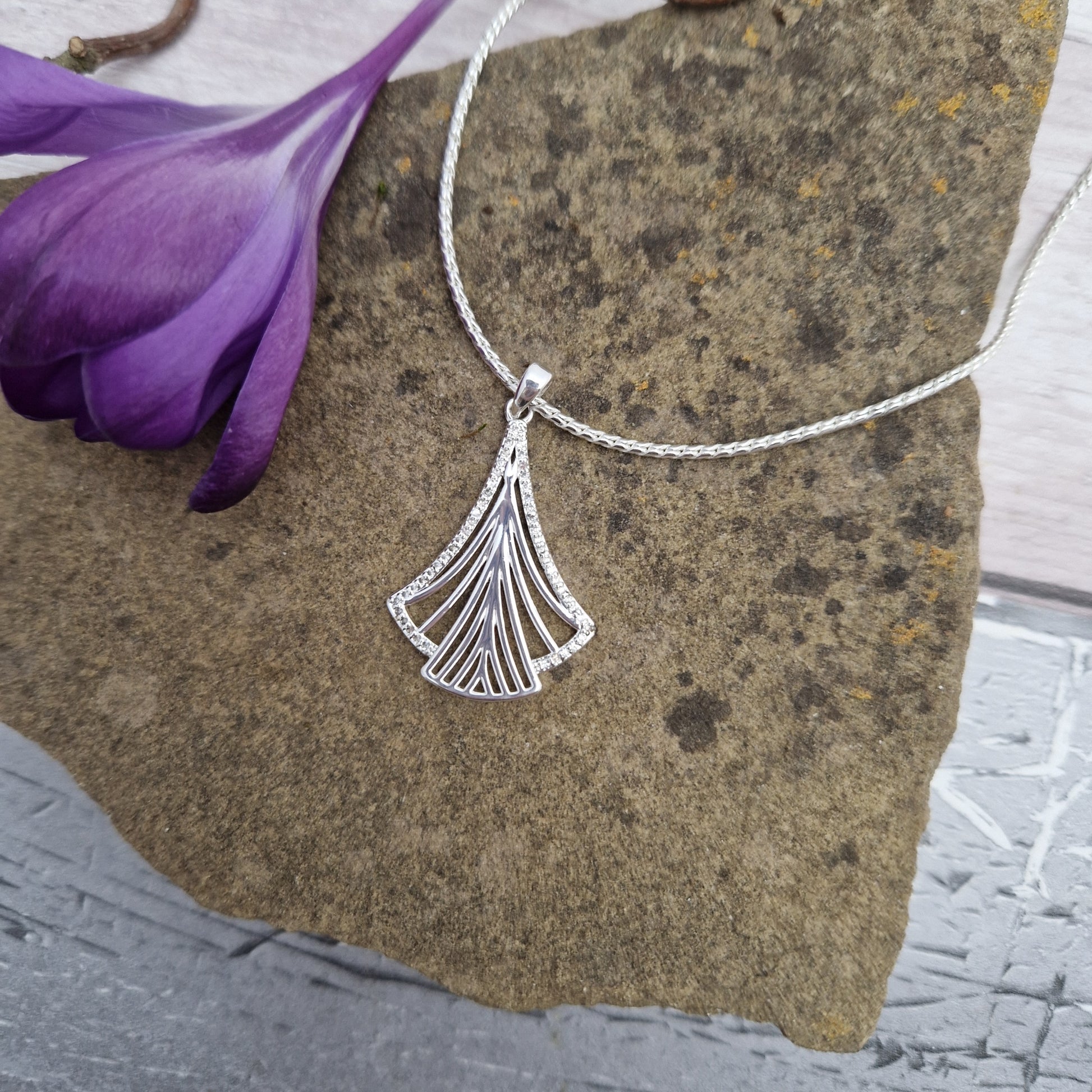 Silver coloured necklace with an Art Deco Fan pendant finished with diamante crystal decoaration.