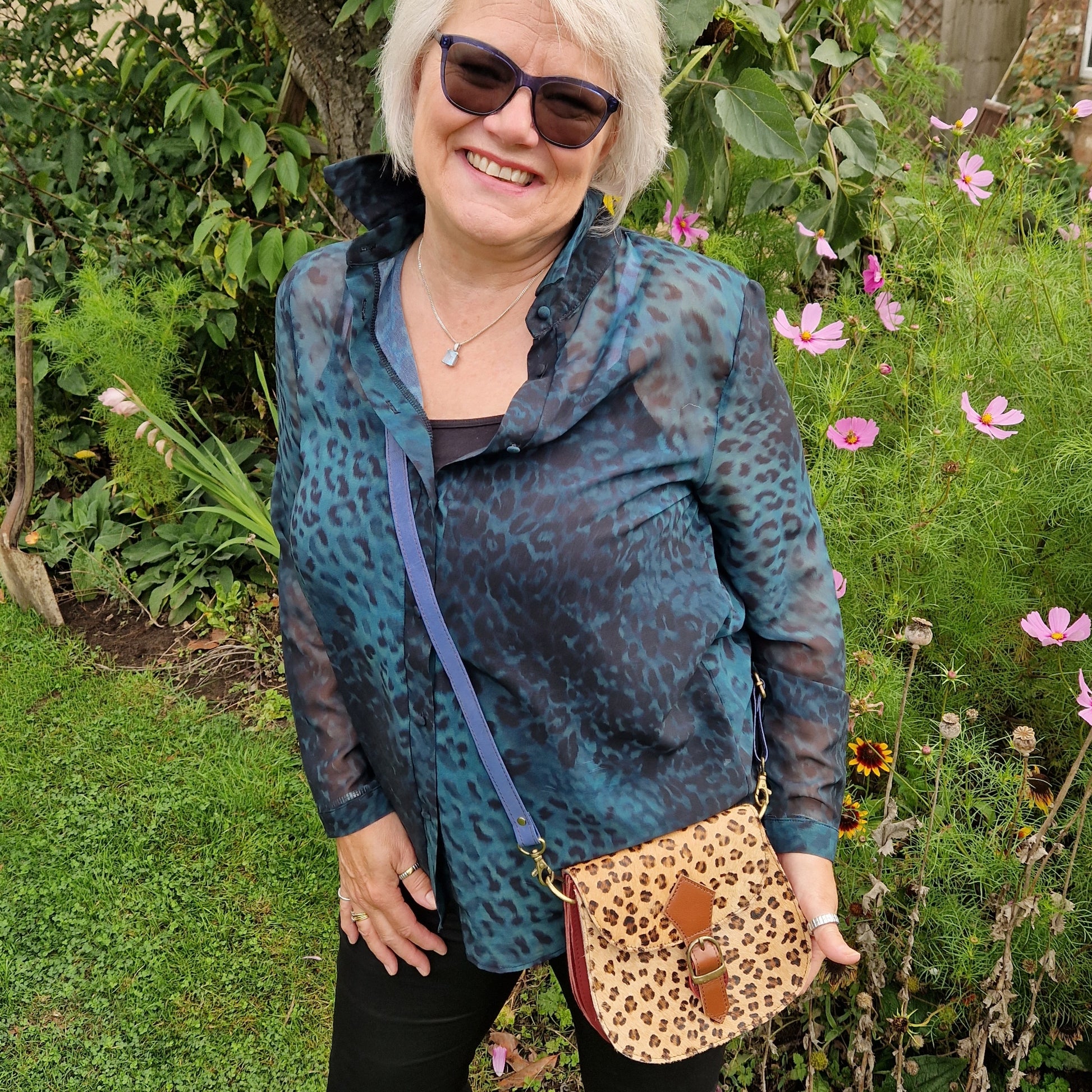 Lady with a leopard print leather bag.