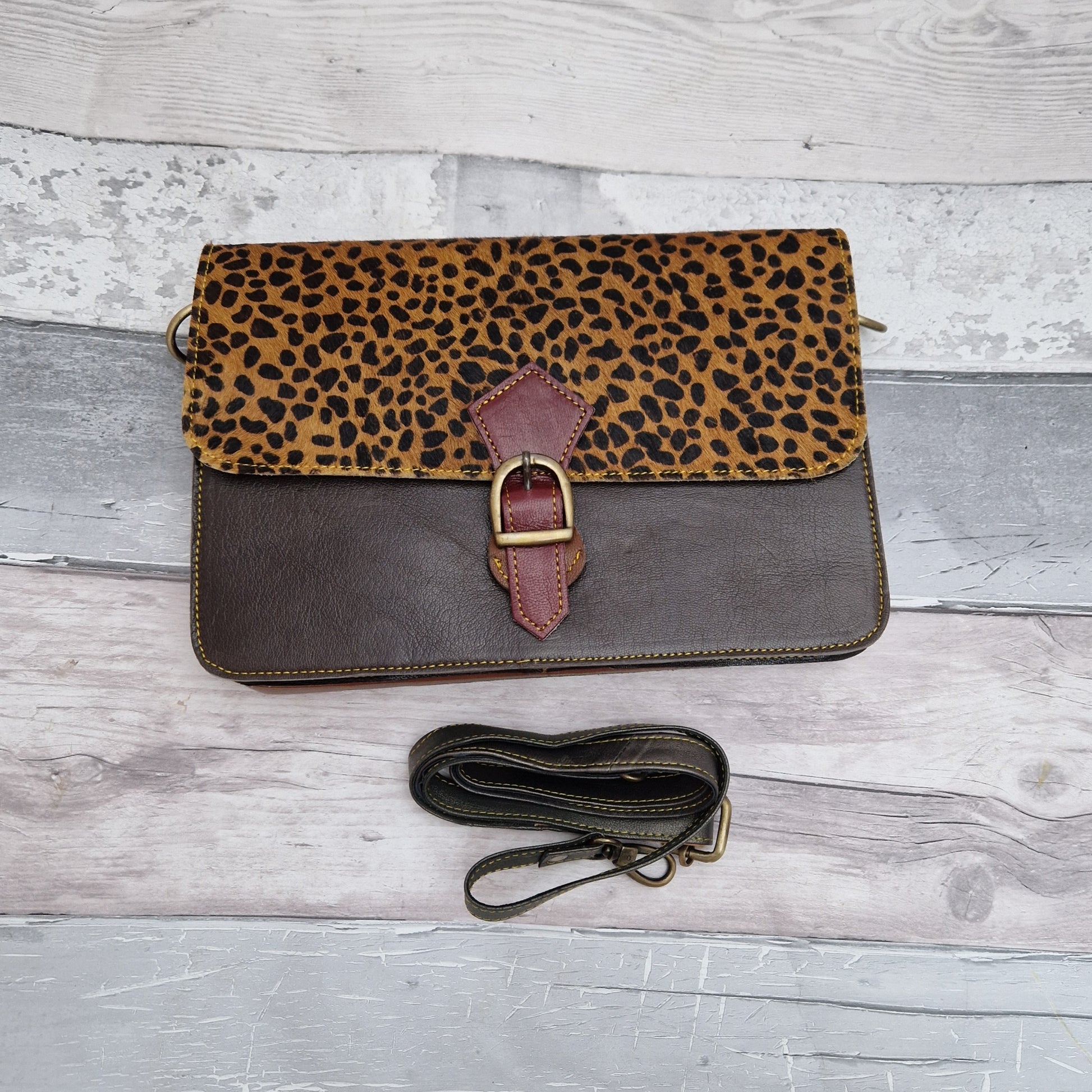 Dark Brown Leather handbag with a textured Cheetah print panel.