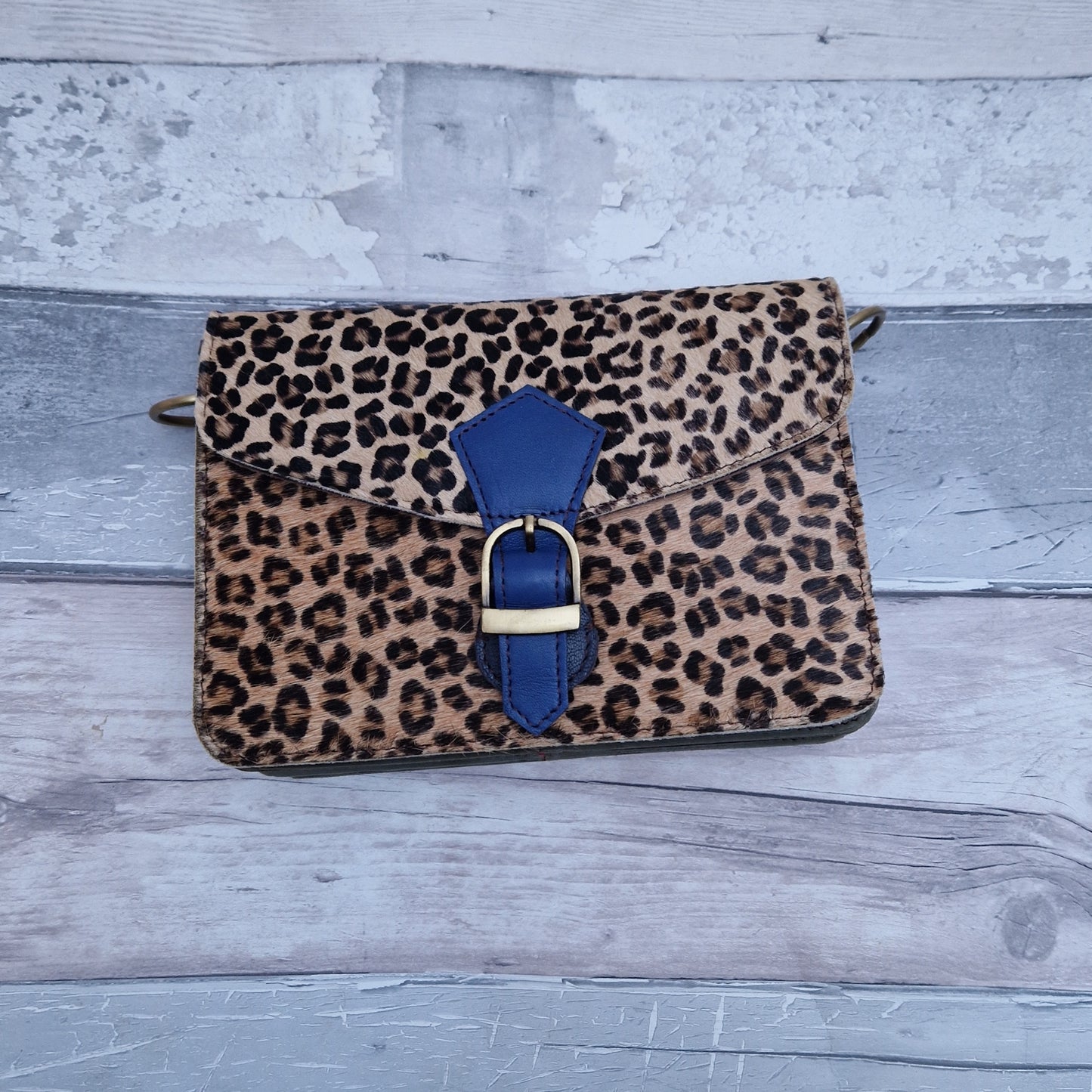 Leather handbag with textured panels of Leopard print.