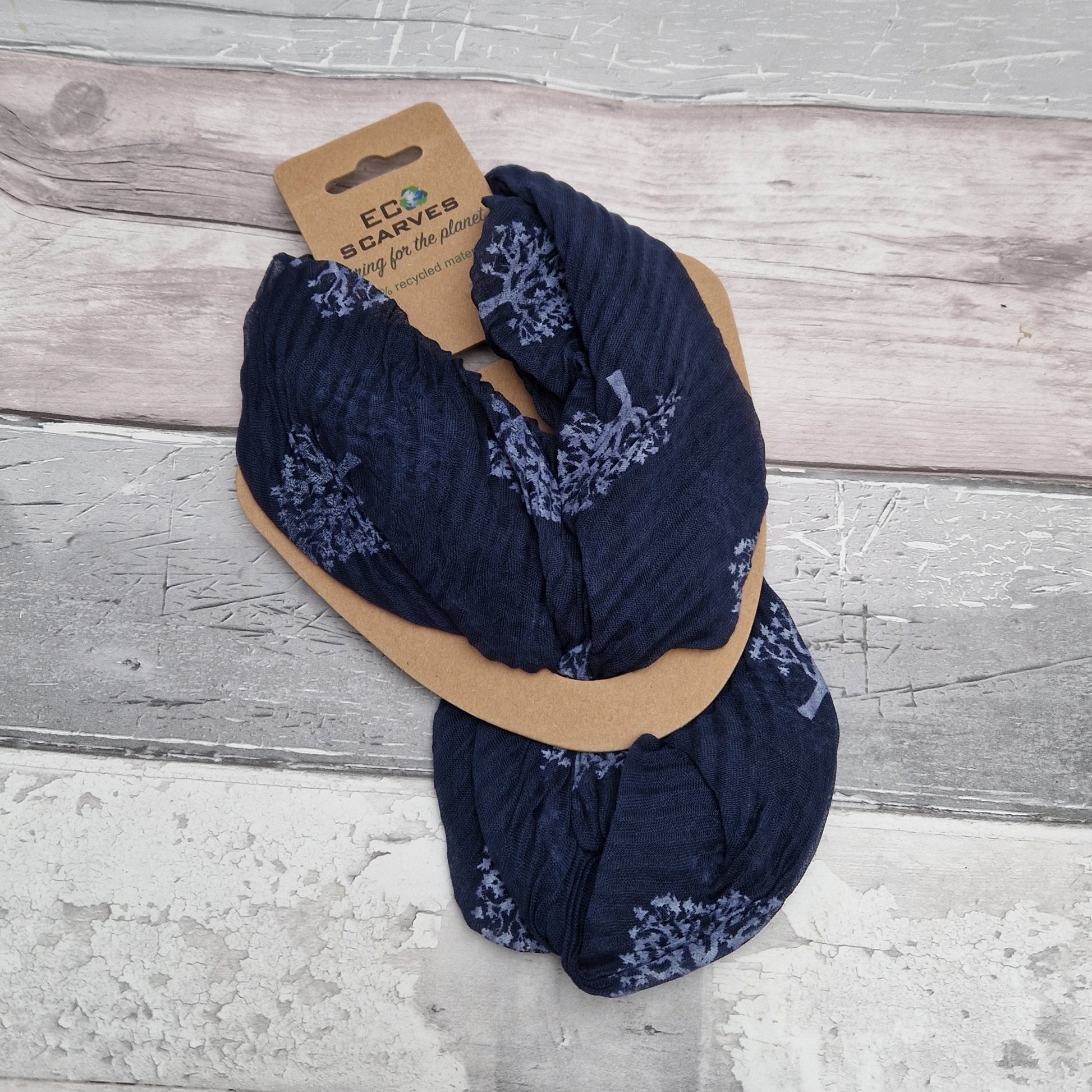 Navy blue neck scarf with magnetic clasp. Decorated with a white bee print.