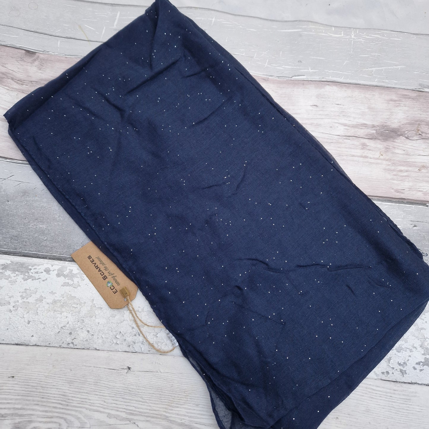 Navy scarf with a silver glitter finish.